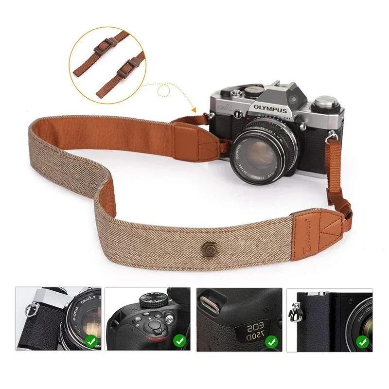 Wide cotton and leather camera strap fitted to a camera body
