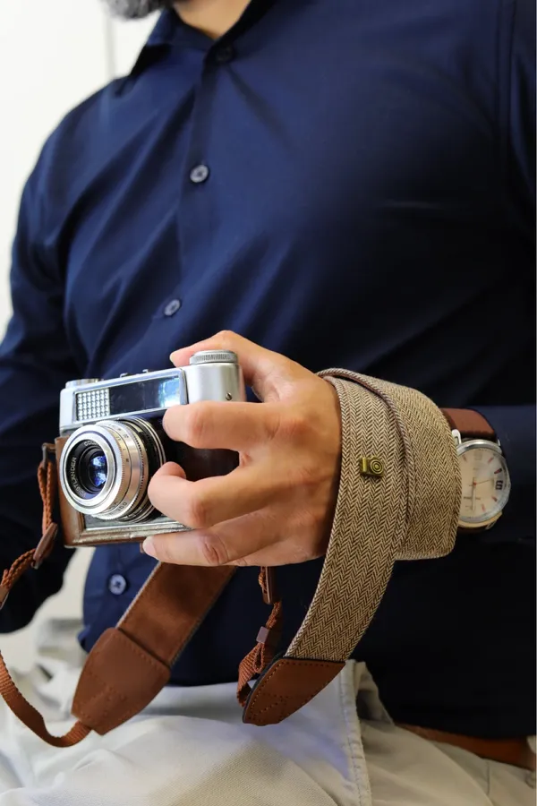 Cotton and leather camera strap photographed by a verified buyer