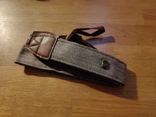Cotton and leather camera strap photographed by a verified buyer