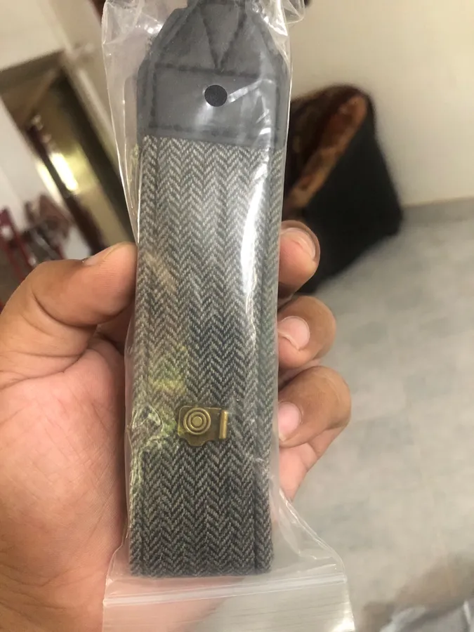 Cotton and leather camera strap photographed by a verified buyer
